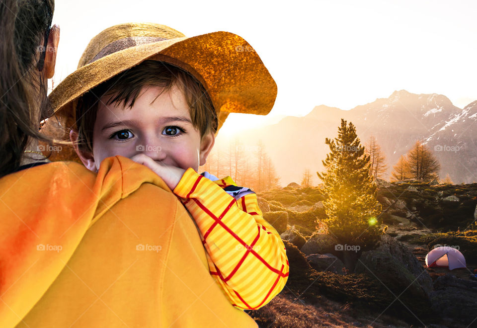 Mother and son camping outdoors in nature