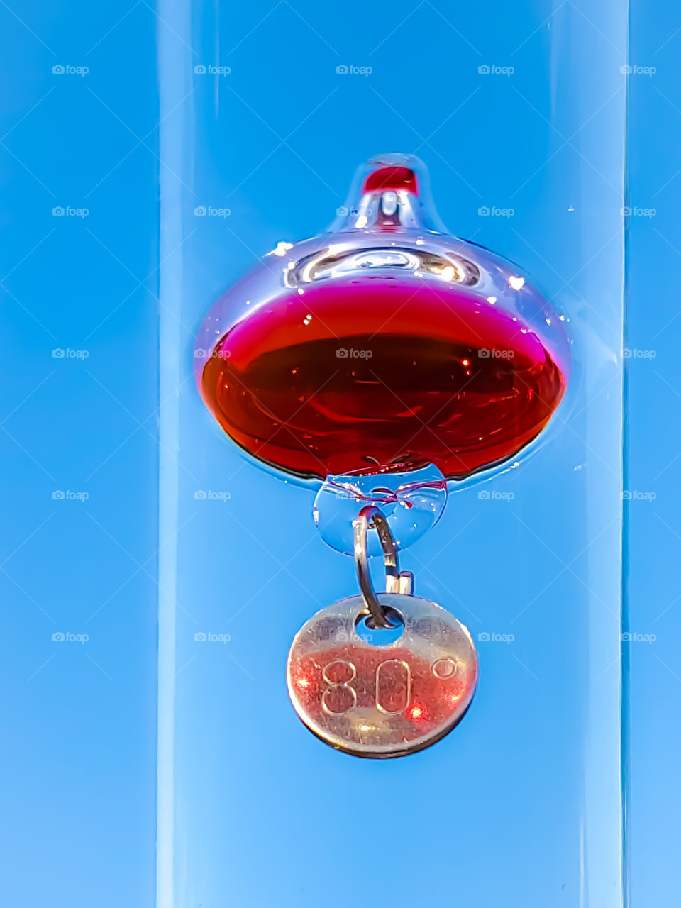 Eighty degree weather according to the Galileo thermometer with a clear blue sky in the background.