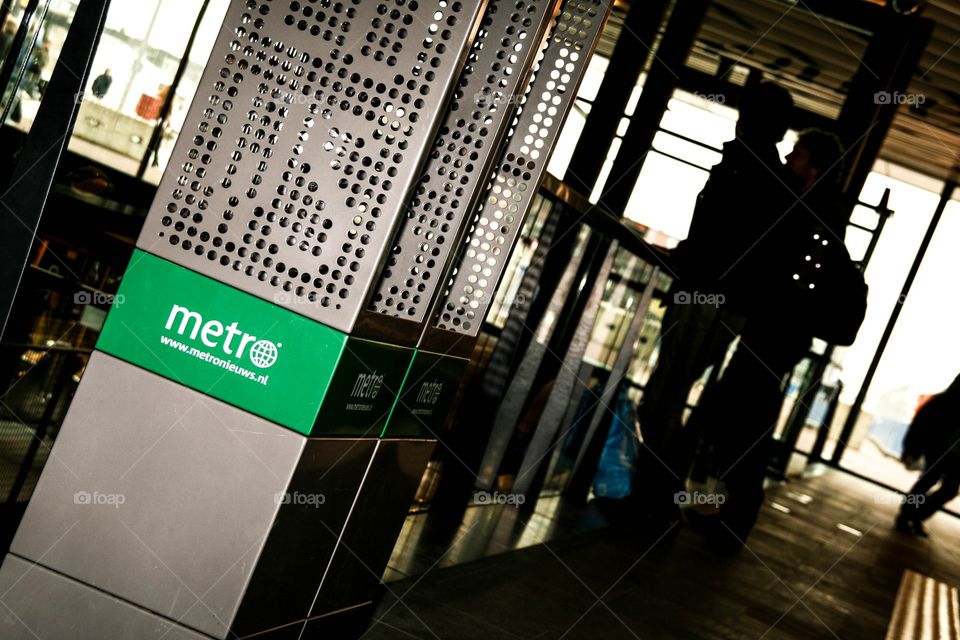 Metro newspaper stand at the train station