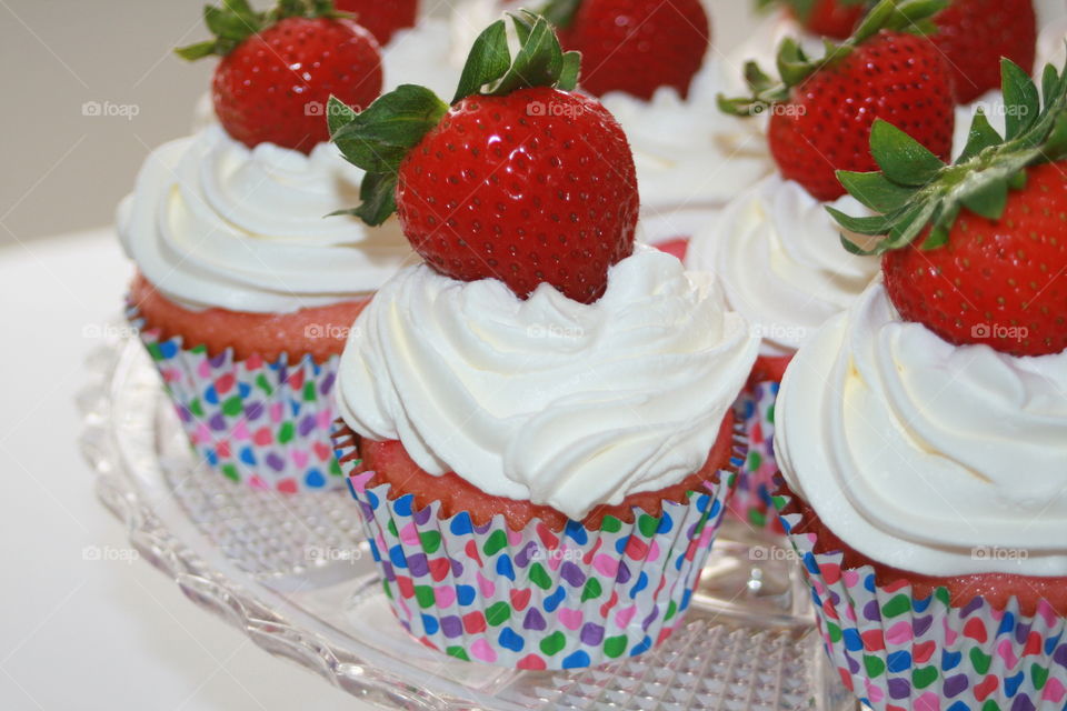 Strawberry and Jello Cupcake with Whipped Cream and Strawberry Garnish