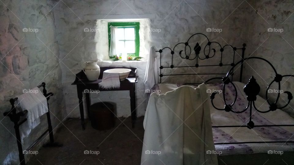 The bedroom of a simple peasant,perfectly preseved and restored in Ulster folk museum,North Ireland