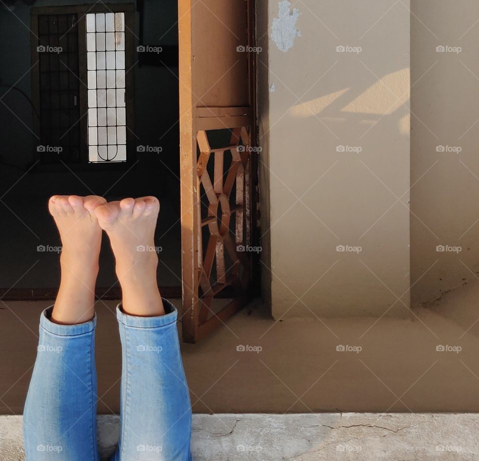 feeling the freedom with hanging feet from terrace..