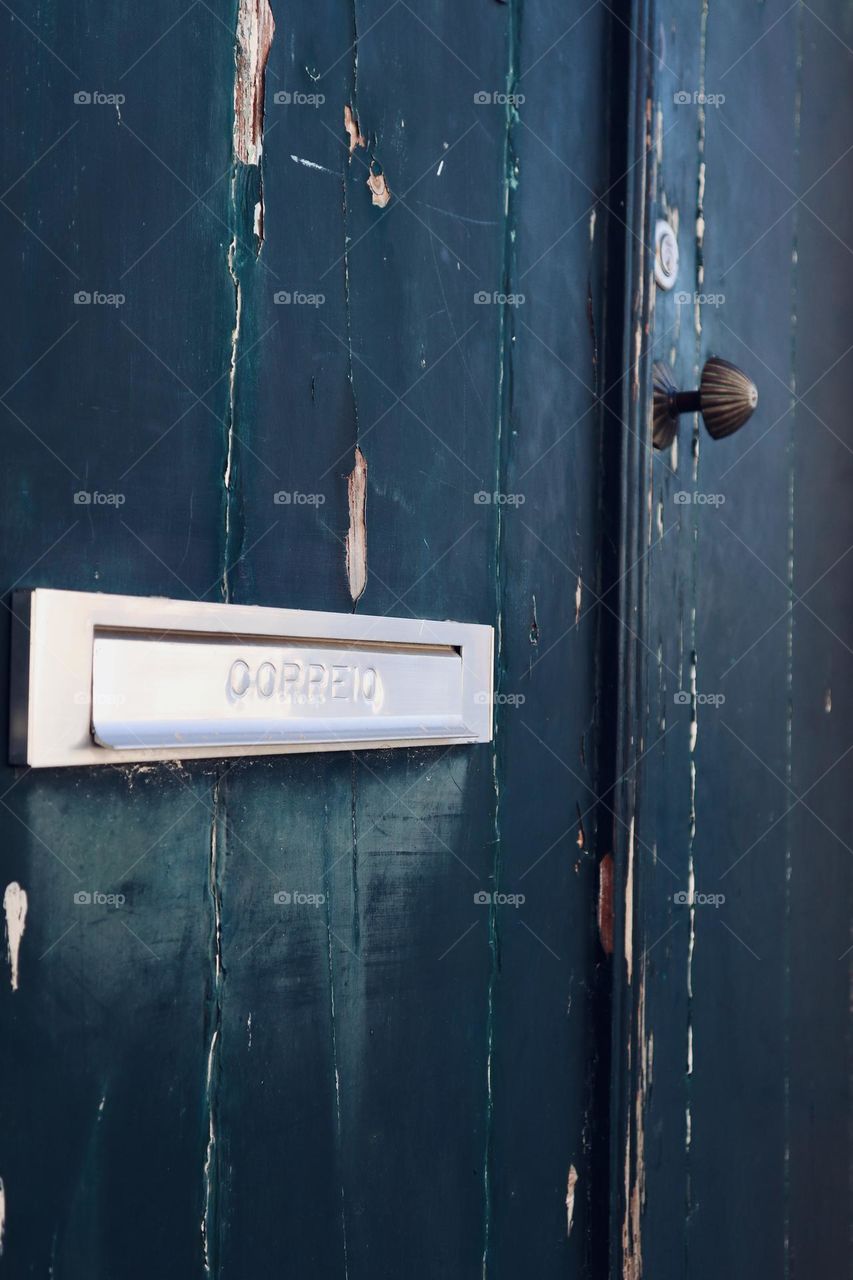 Old green door and it mailbox 