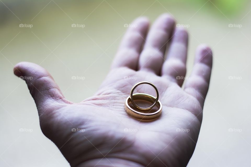 wedding rings in hand