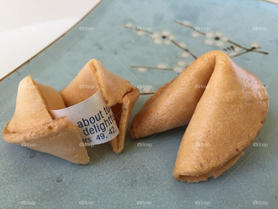 Fortune cookie. Fortune cookie cracked open with message inside 