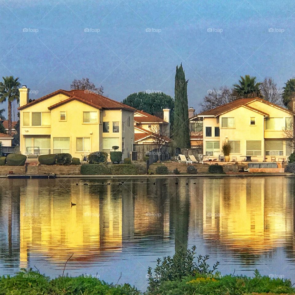 Houses reflected on a lake