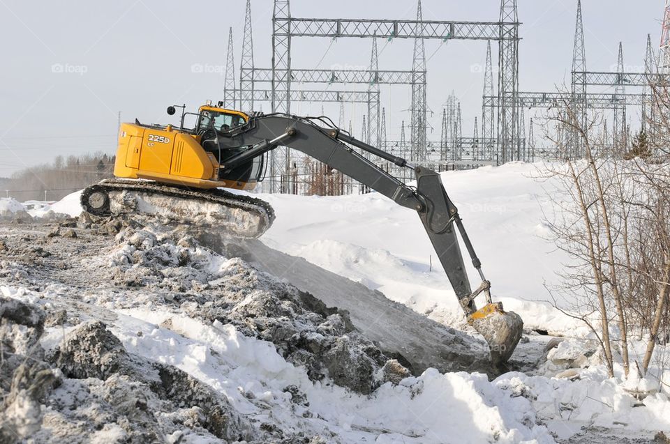 Excavator on winter worksite