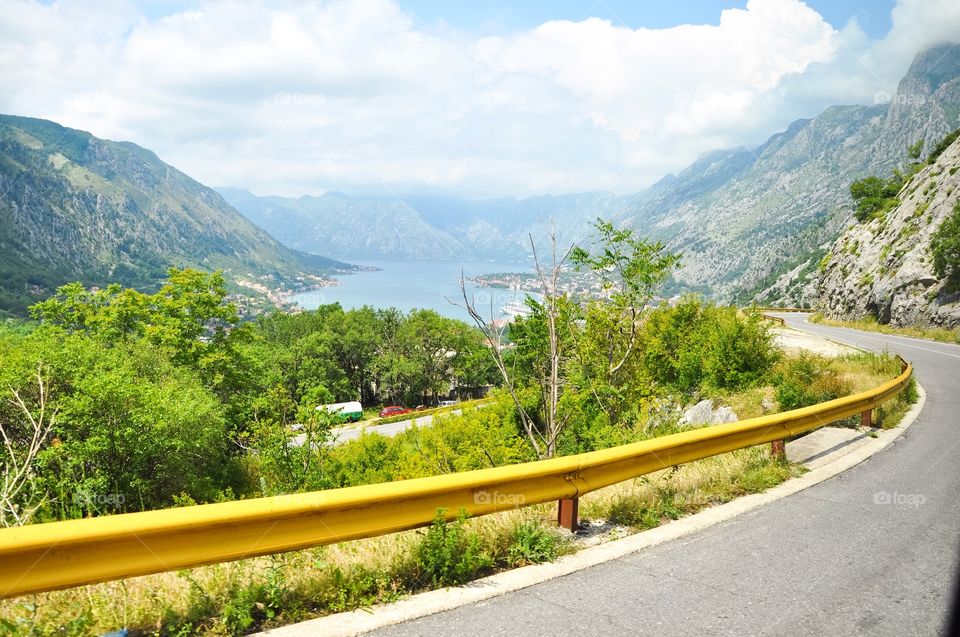 Scenic view of street and mountain