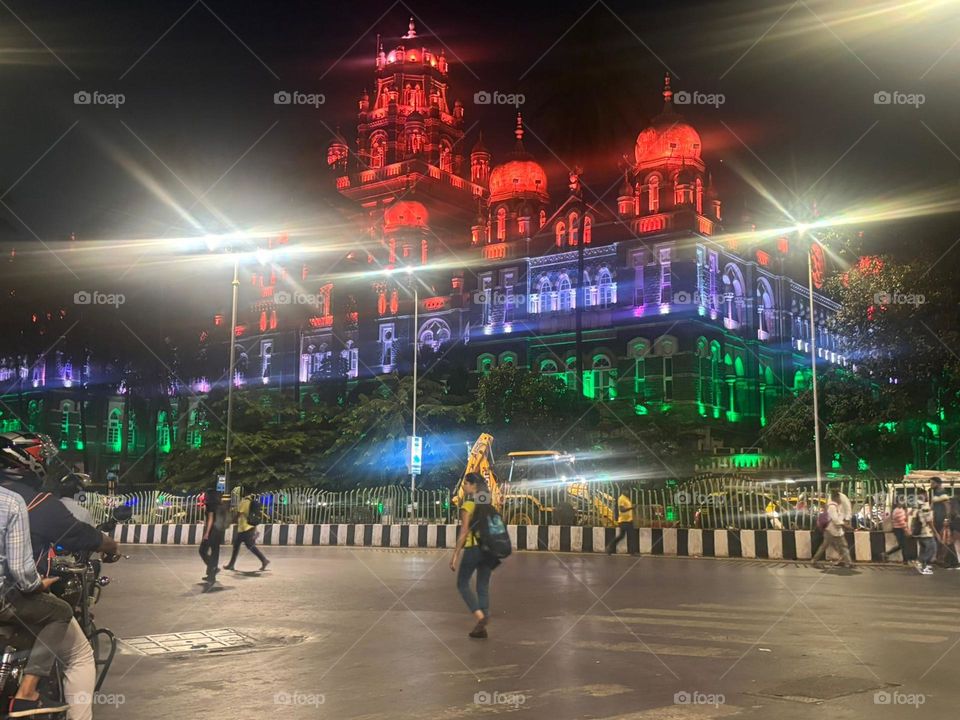 Indian ancient times monument decorated with beautiful colourful lights. eye catching image on the side of a road.