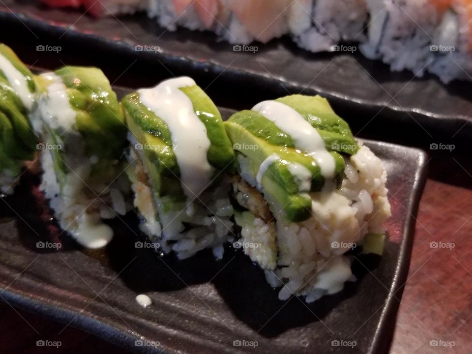 Delicious sushi rolls with avocado, crab, unagi eel, nice and light meal 