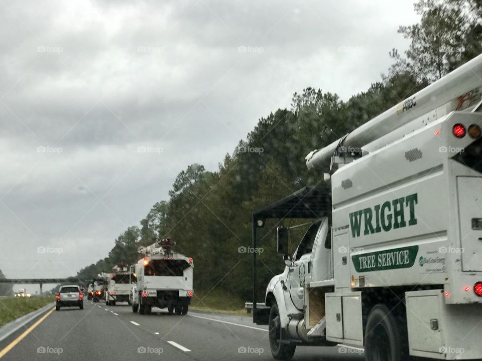 Following a convoy of tree trimming trucks on I 65 south. Wright tree trimming