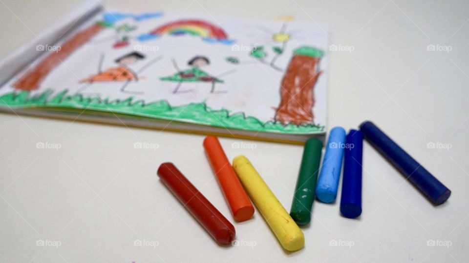 Colored crayons and drawings