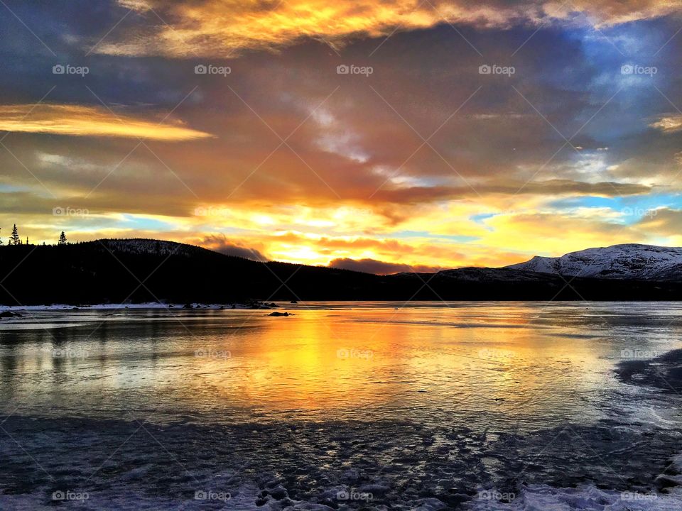 Sunset on winter lake 