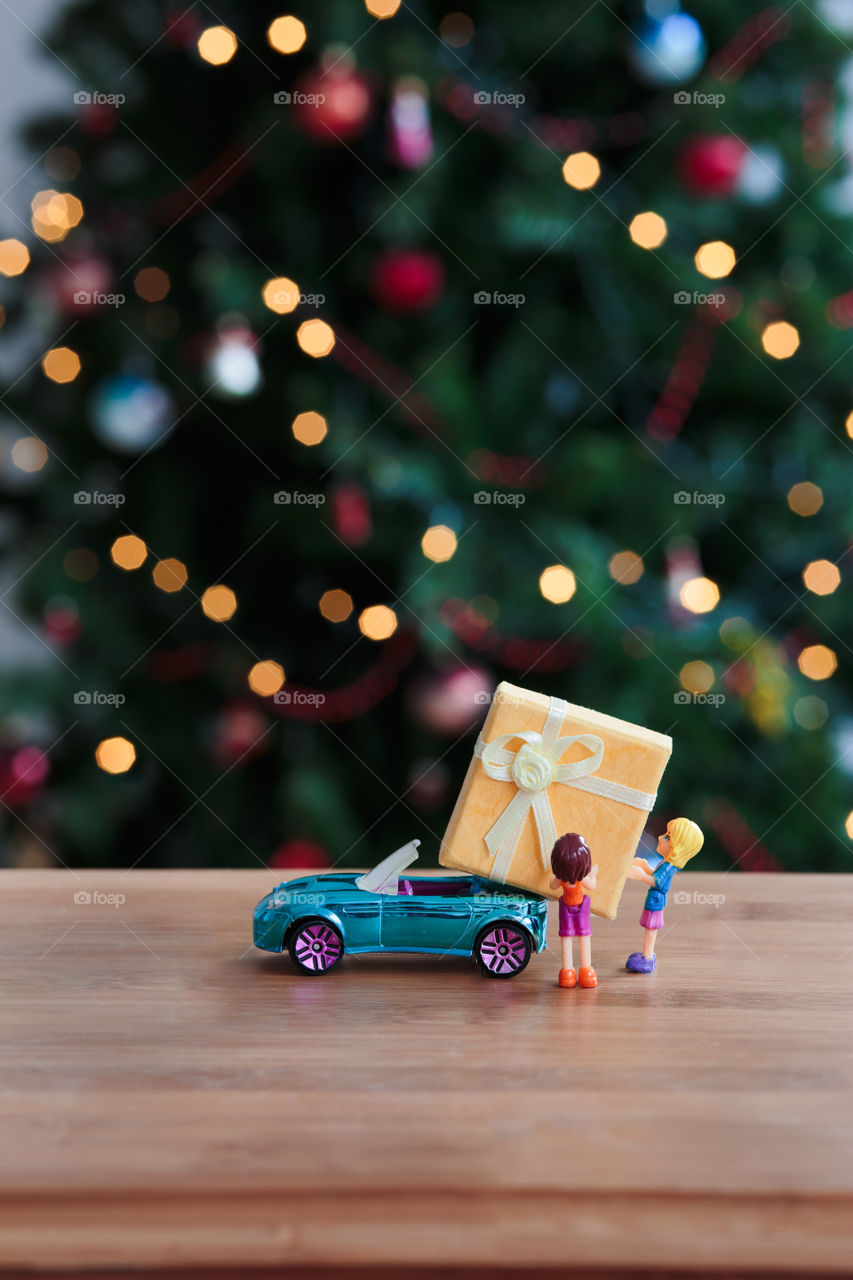 Christmas gift with toys on table