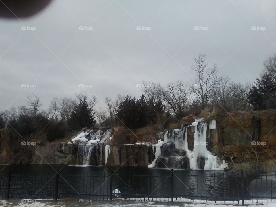 The partially frozen waterfalls still flowing at Daggett Memorial Park in Montello, Wisconsin.