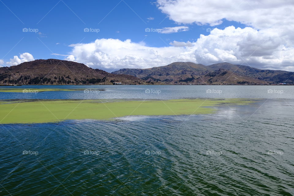 View of the uros on the horizon over lake titicaca