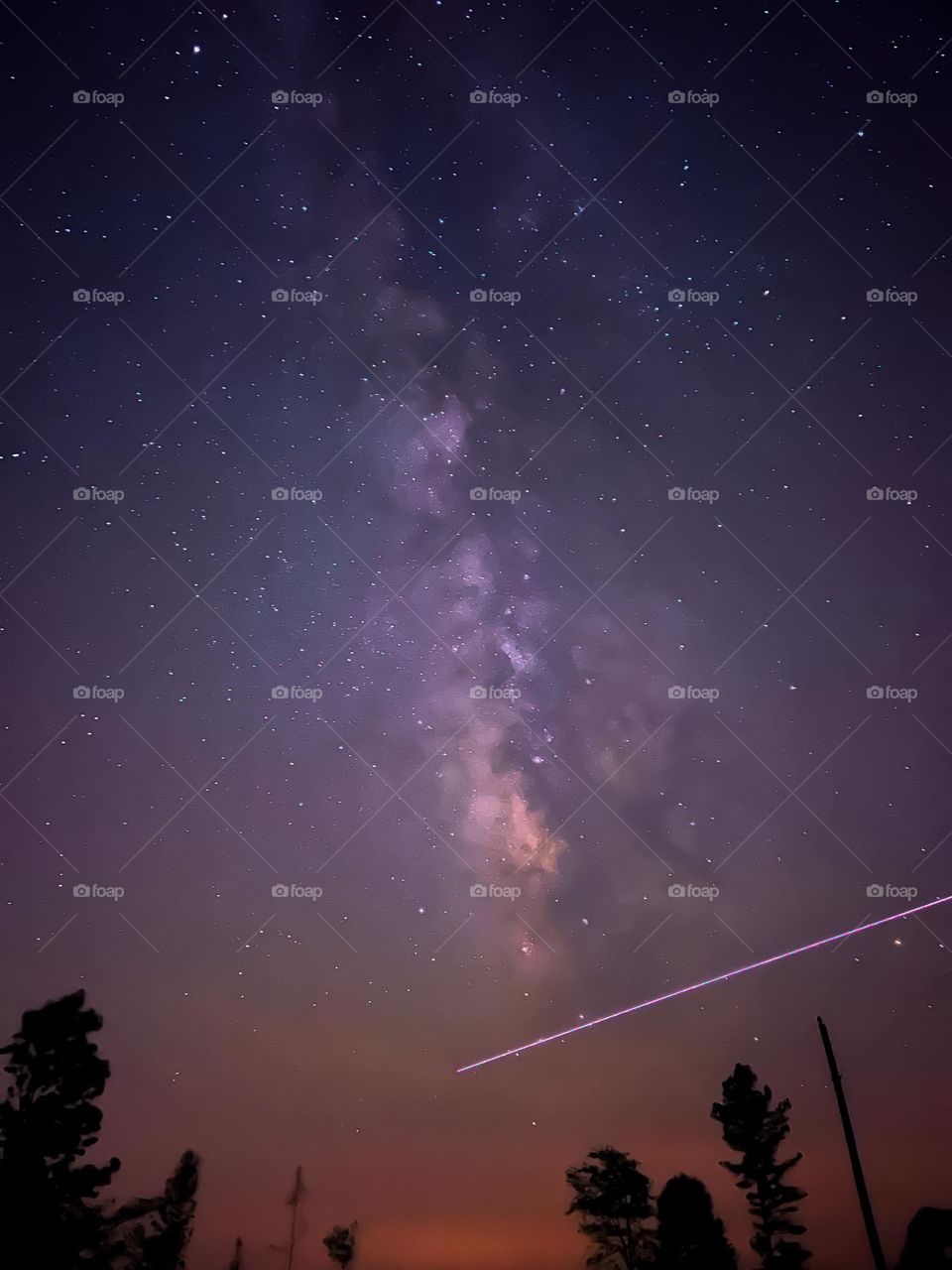 Long exposure of the Milky Way rising as the International Space Station crosses beneath it.