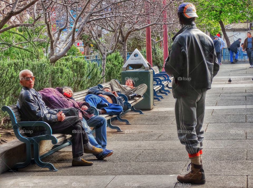 Homeless People Sleeping On Park Benches. Urban City Scene
