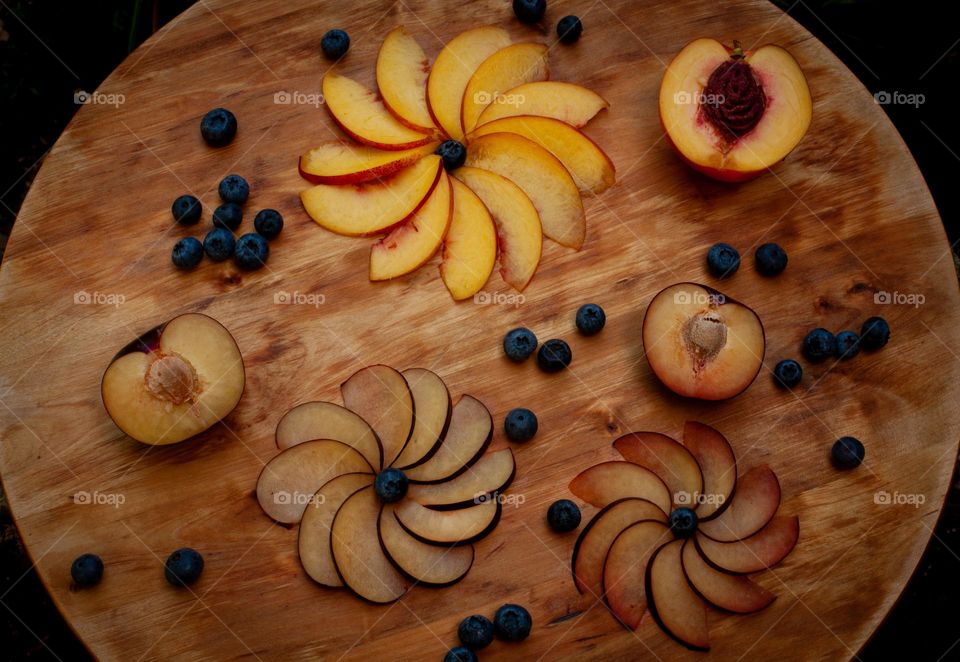 Summer fruits snack - plums, peach, blueberries 