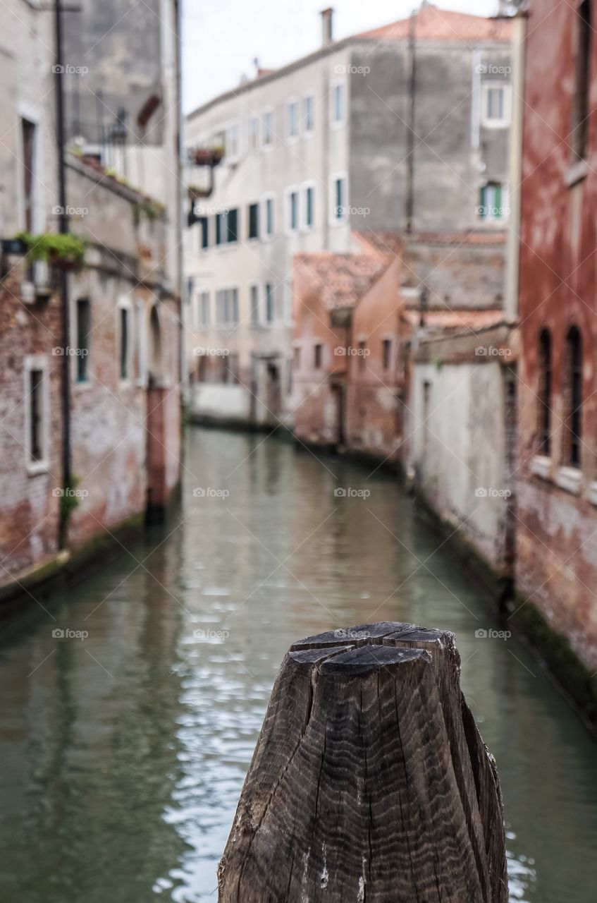 Narrow canal along buildings, Venice