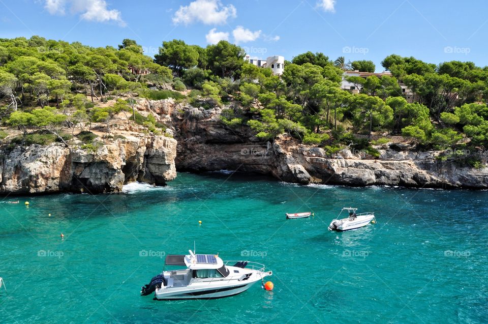 cala santanyu view with boats and yachts on mallorca balearic island in spain