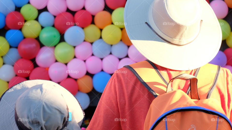 People watching colorful balloons