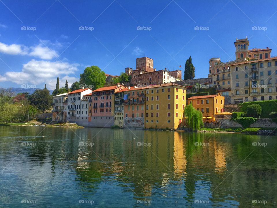 Reflections in the river . A spring day in Bassano Del Grappa
