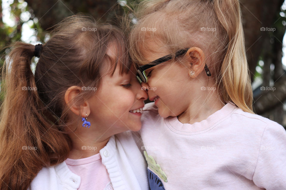 Sisters hugging each other