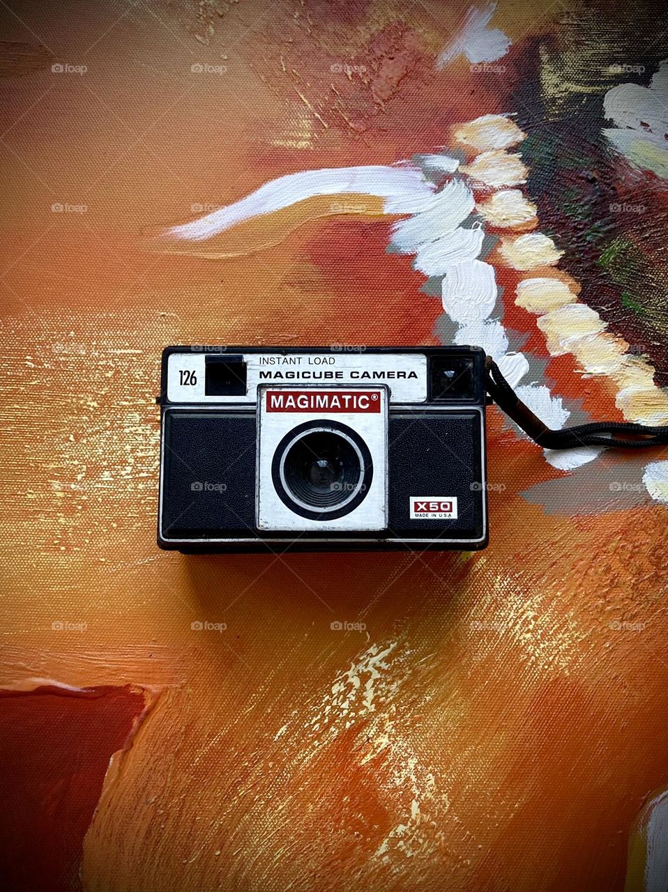 The Magimatic, X50, Instant Load, Magicube Camera, 126 film with strap. 1960's on acrylic canvas painting