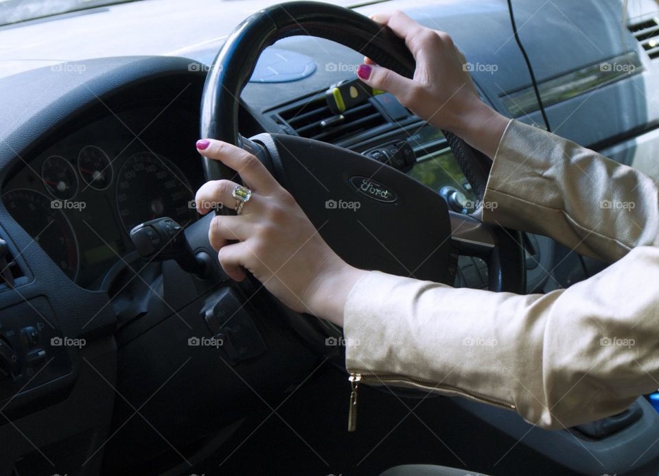 A girl rides in a car on the road