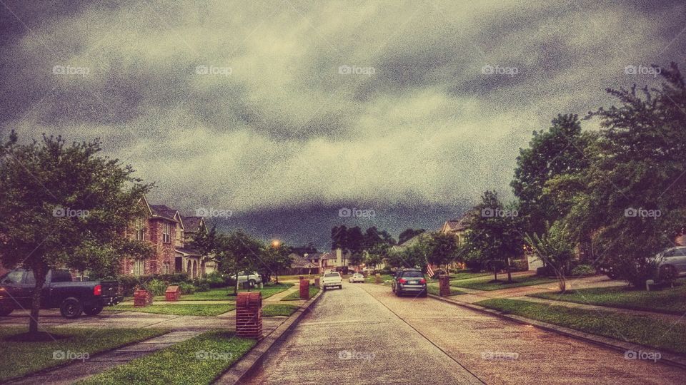 Storm Face. This was taken during the beginning of the storms in Houston. There is a face with a mouth open ready to devouer the street