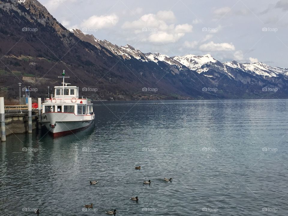 Boat docked at the pier by the lakeside 