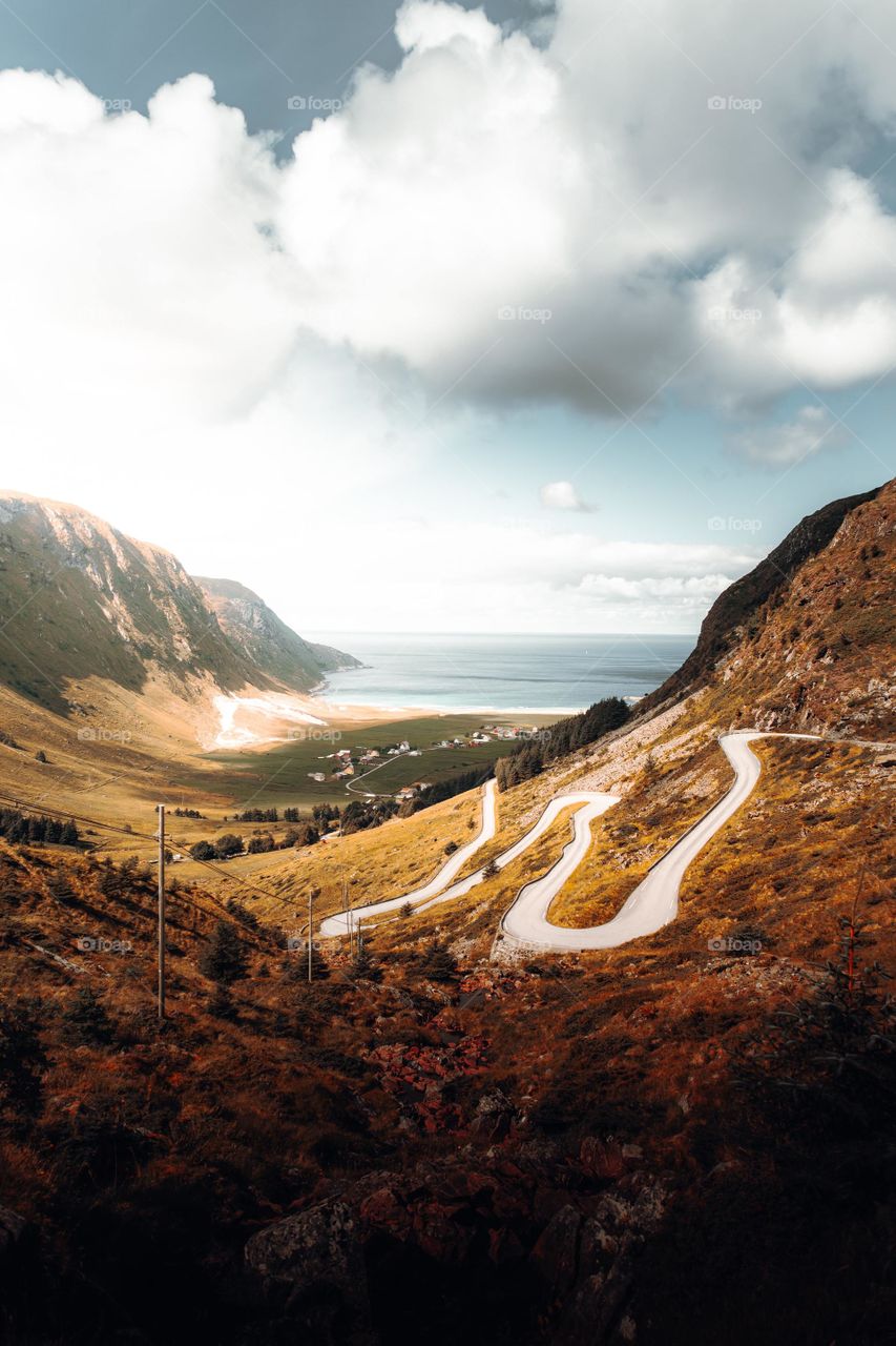 Aerial view of road between mountains during day time