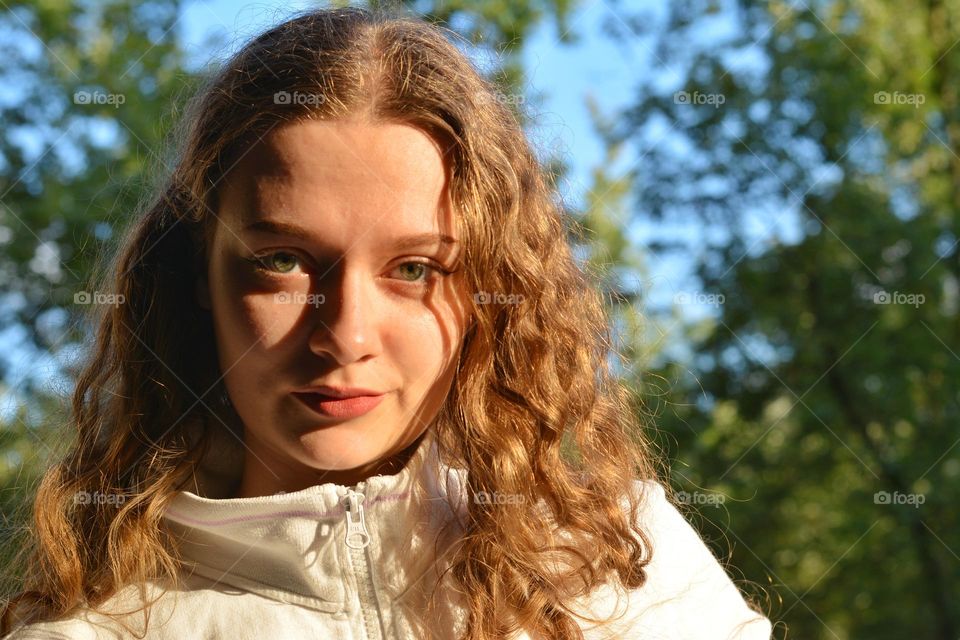 young girl beautiful portrait in sunlight