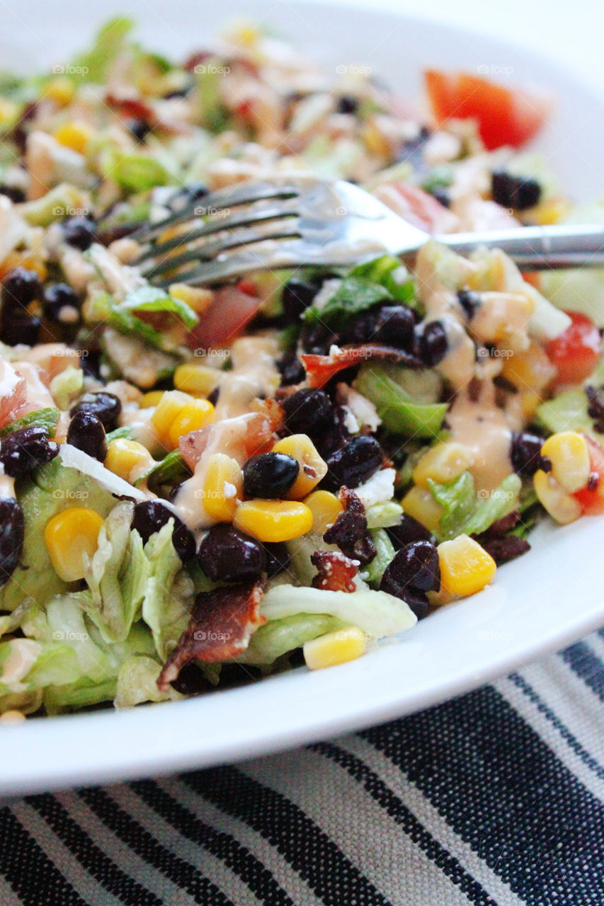 Close-up of salad bowl with fork