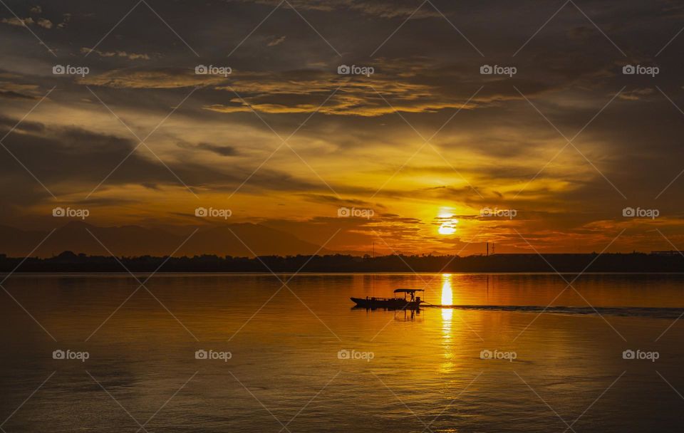 Sunrise on Red river with dramatic sky