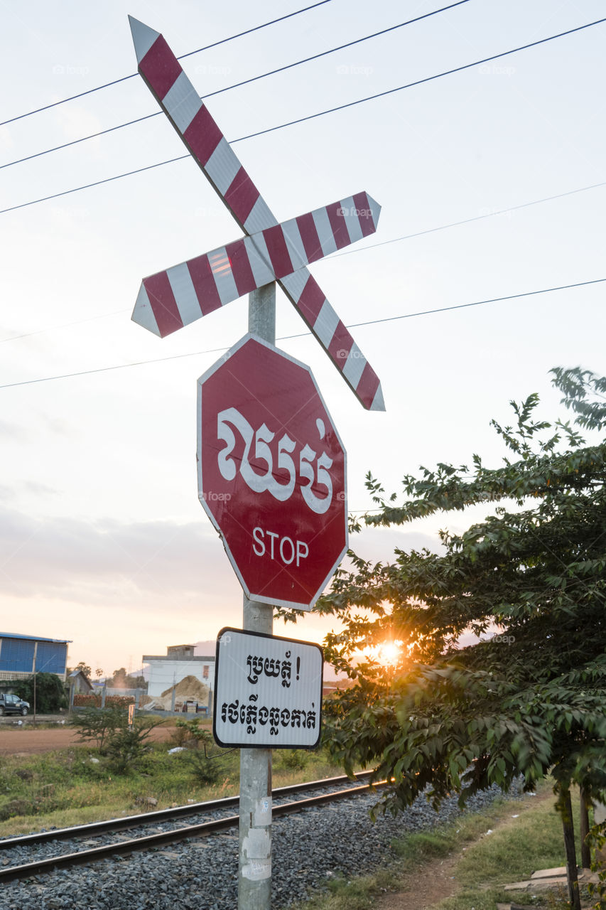 Stop sign has been use when there is train pass by in Kompot province, Cambodia 