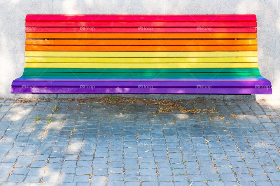 Park bench in beautiful bright pride colors 
