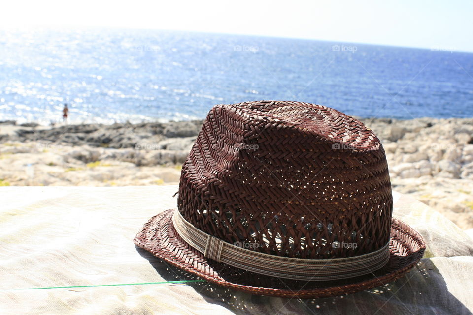 Hat on sand