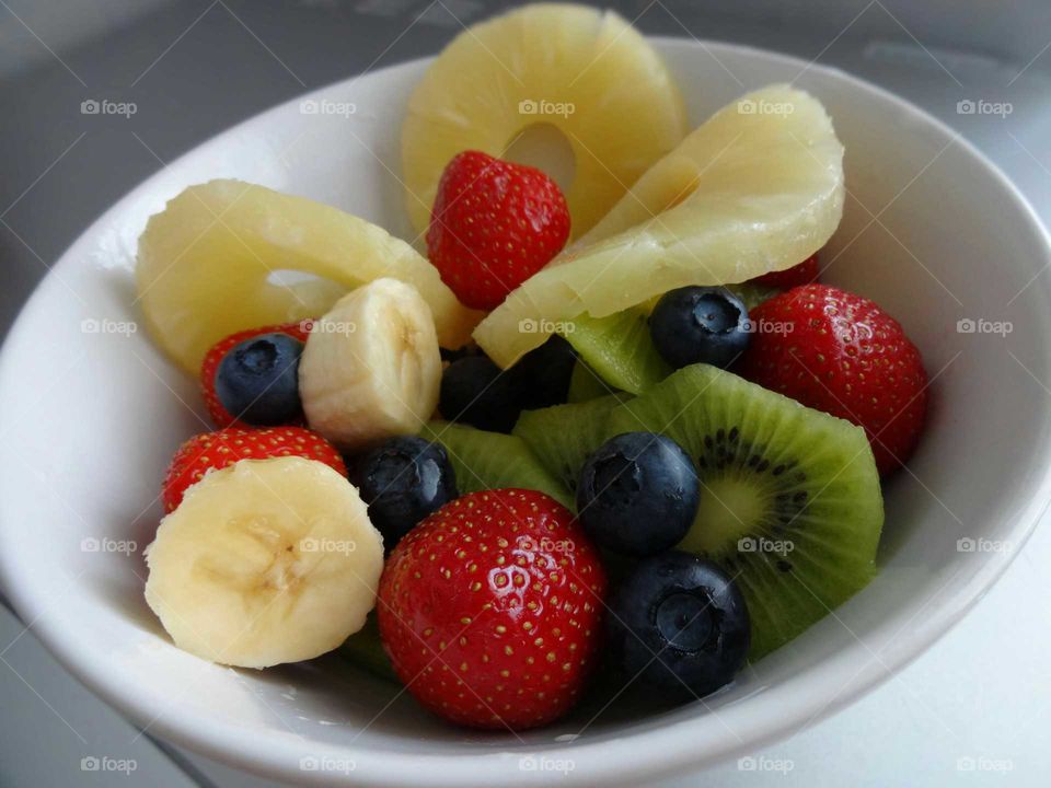 Fruit salad in a ceramic bowl