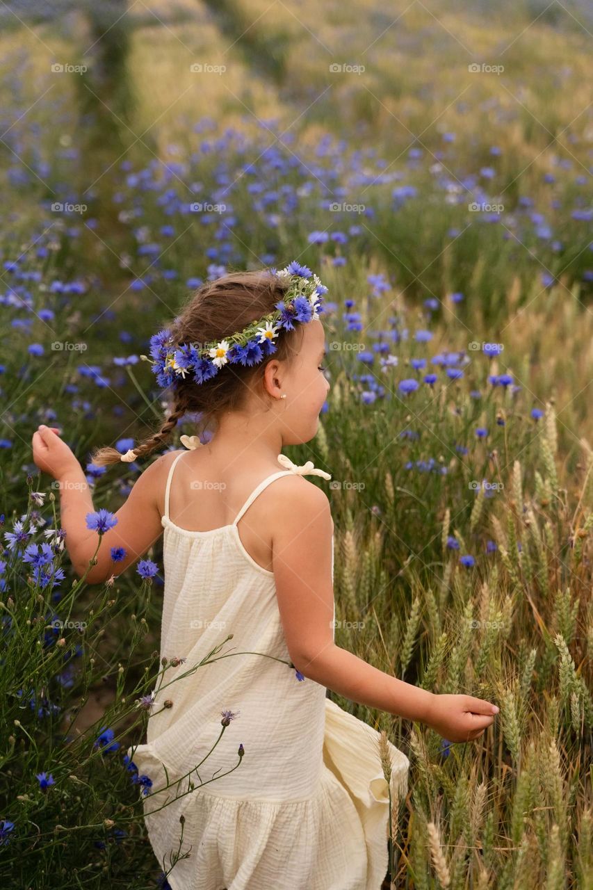 Girl with a wreath of wild flowers
