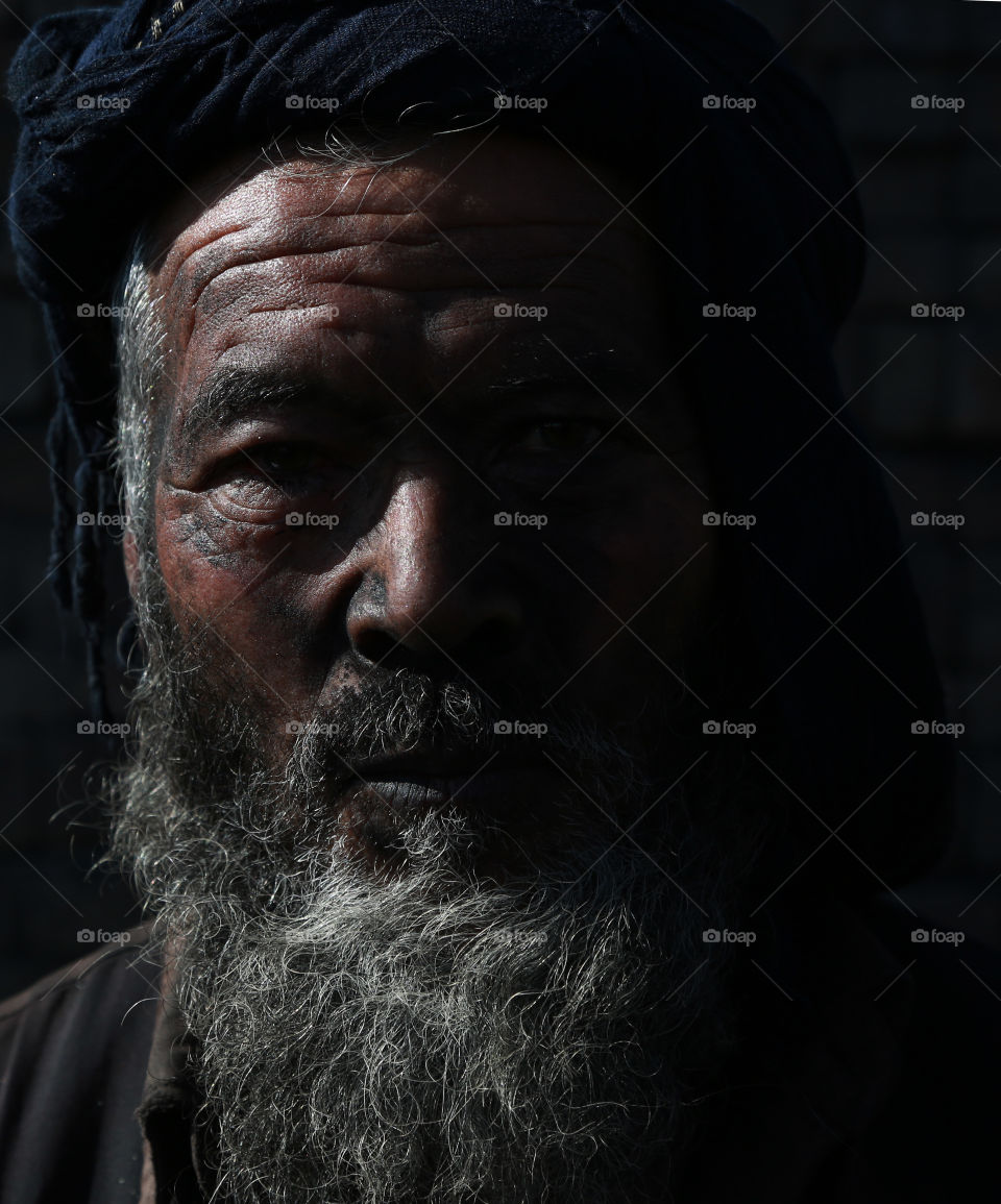 An Afghan man work at coal market in Kabul . 