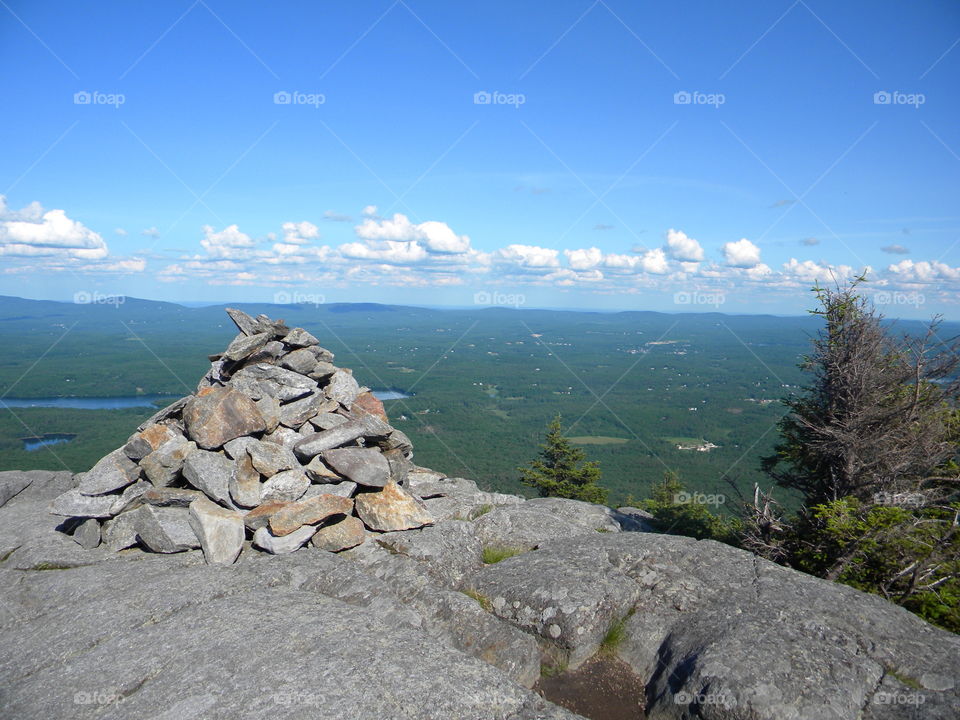 Pile o' stones on top of a giant stone