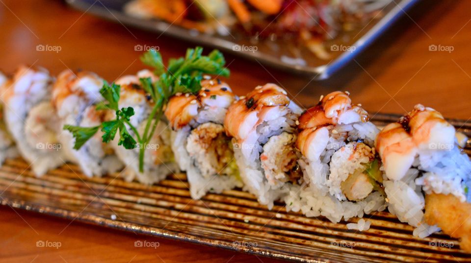 Fresh Shrimp sushi roll with a garnish 