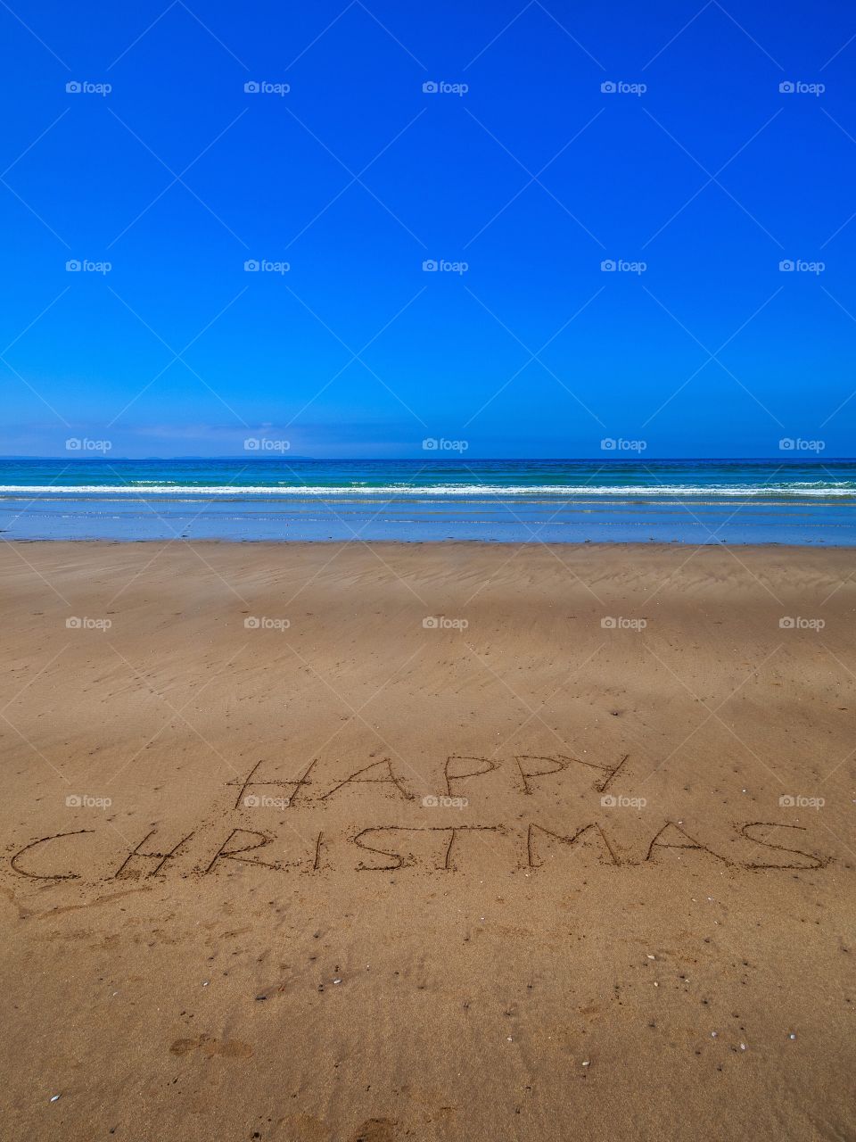 Happy Christmas beach writing