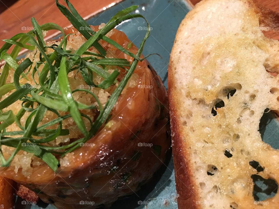 Salmon Tartare terrine with toasted french bread and herbs 