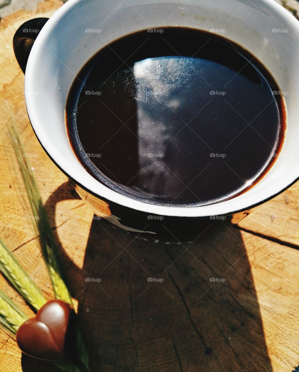 black coffee in the morning sun