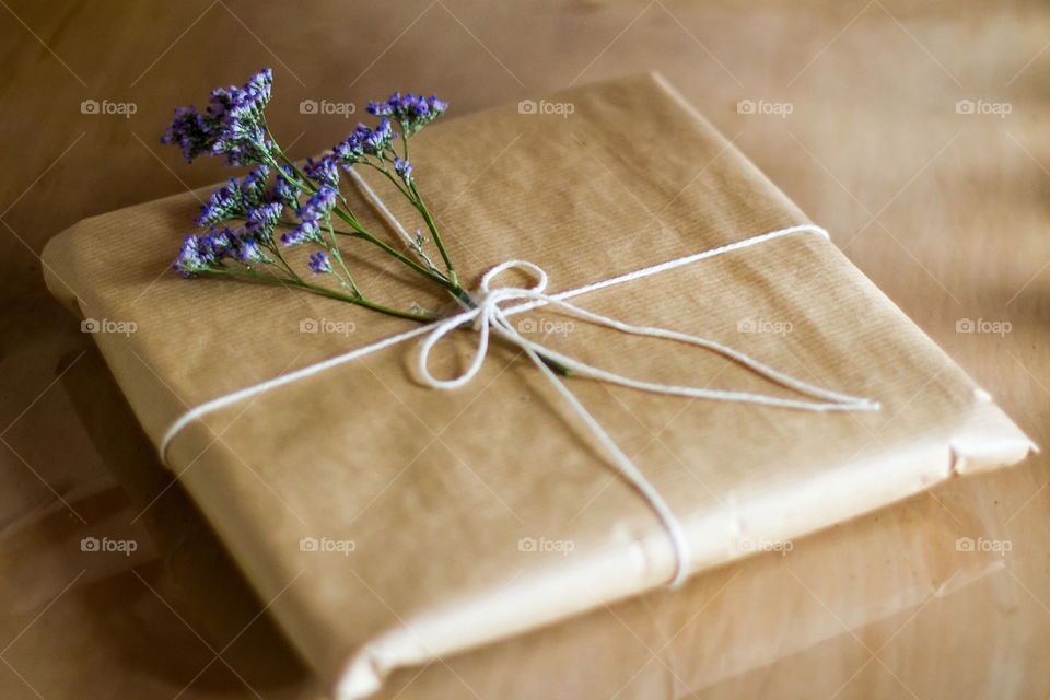 Festive season in sunny South Africa is about pretty flowers and being outdoors. Pretty gift wrapped in simple paper with purple flower.