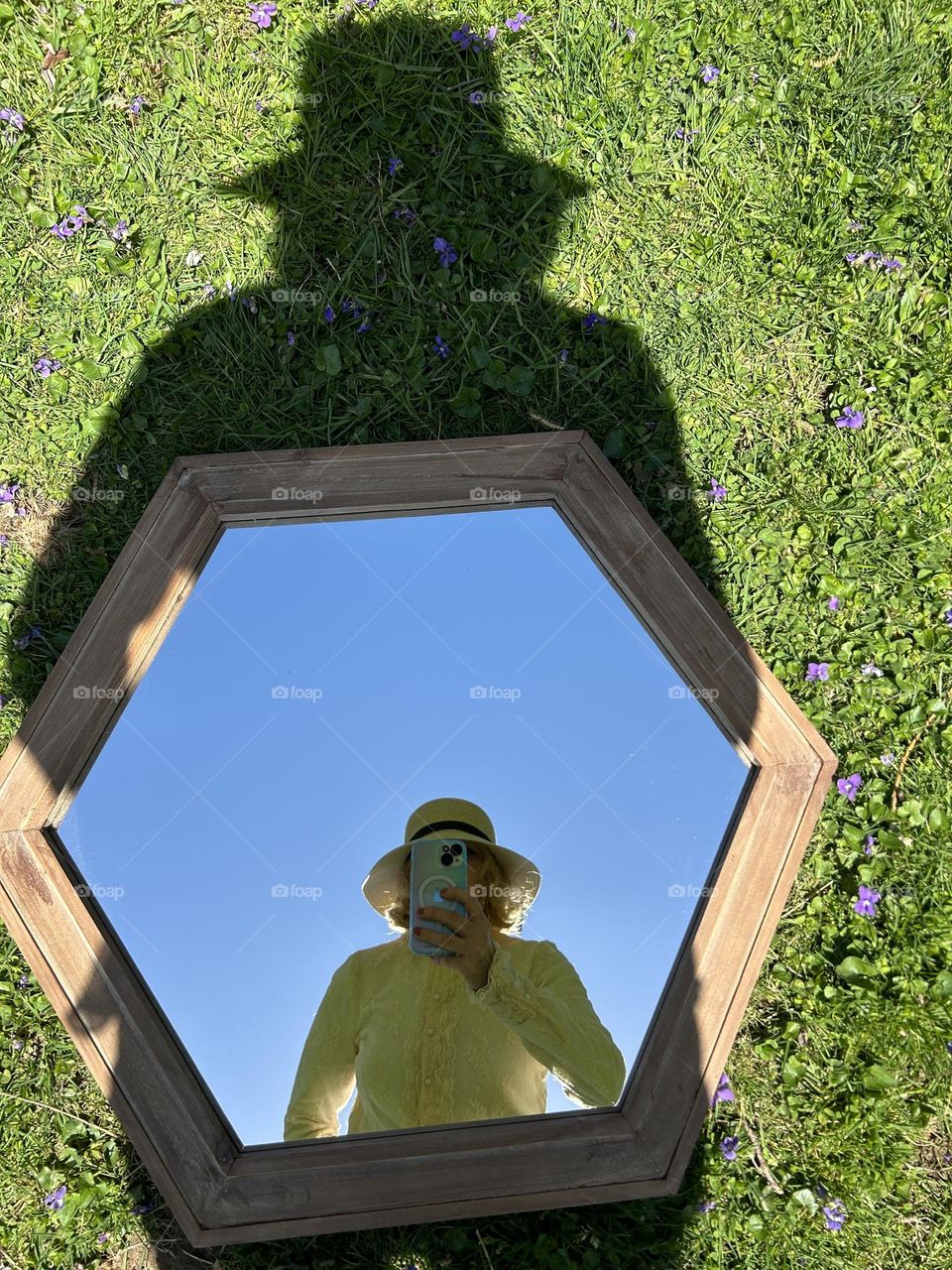 Selfie in a mirror with shadow above 