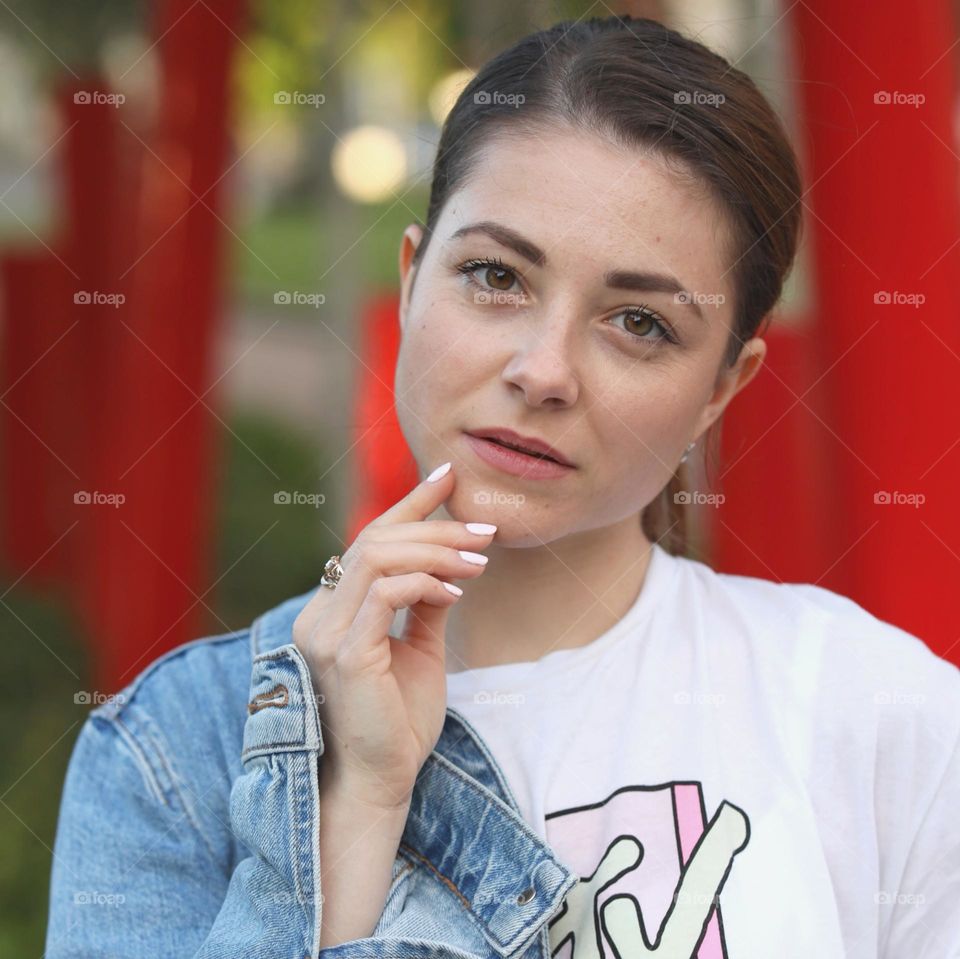 Natural beauty, natural womаn. Young lady portrait. Sport style. Denim jacket and t-shirt. Brunette with nice eyes. Portrait without digital retouching.